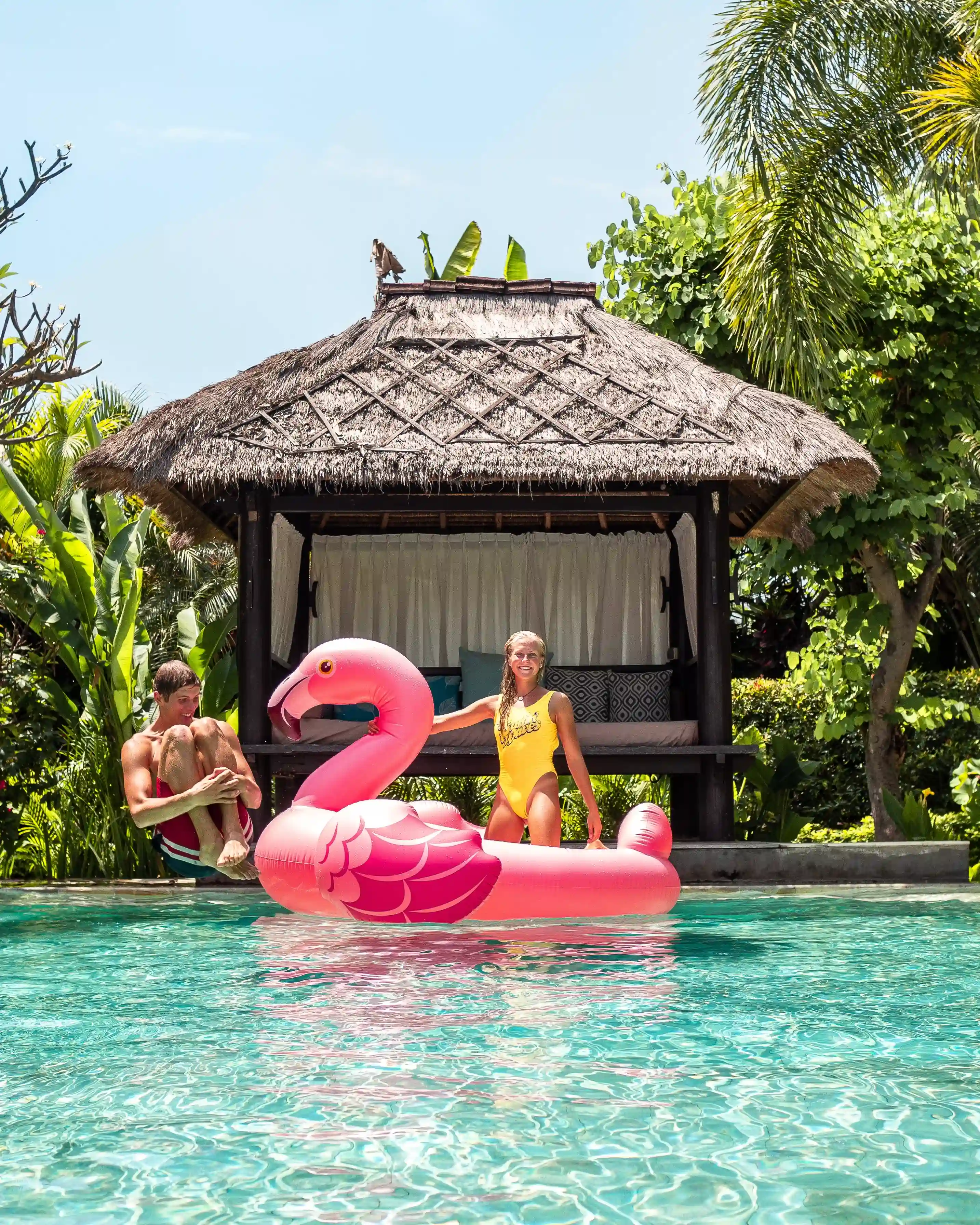 Seating area by the beach during sunset at Mayo Resort Bali